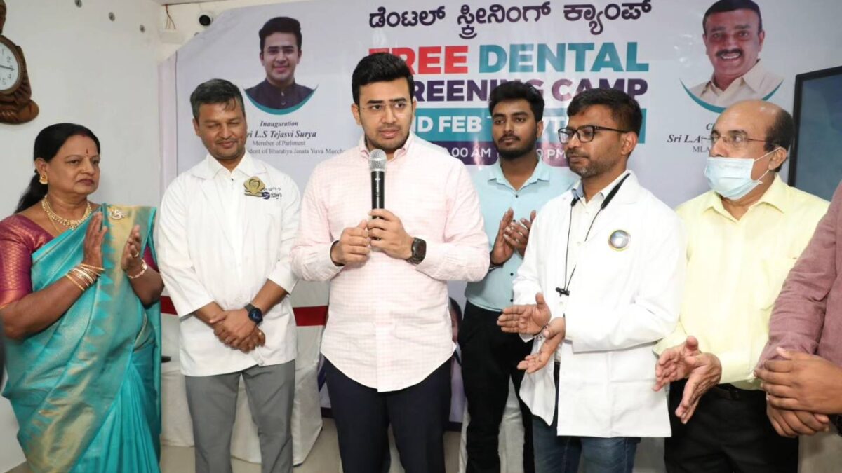 Tejaswi Surya, giving a speech alongside the Sujay's Dental Clinic team and community at a free dental camp